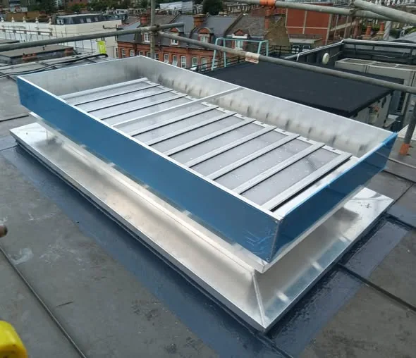 Smoke vent waterproofing detail on a Putney office roof